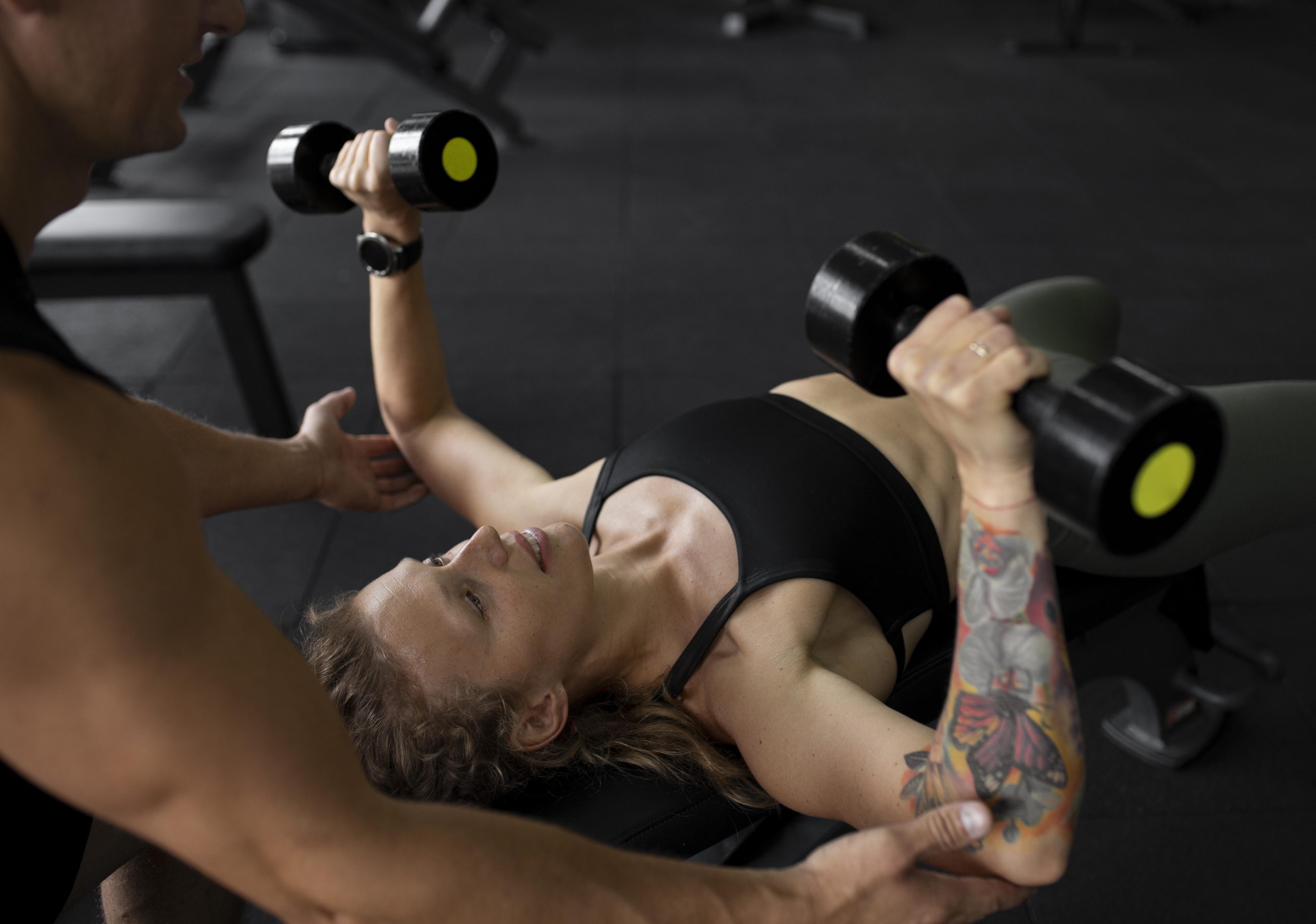 close-up-woman-training-with-dumbbells
